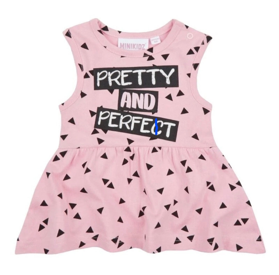 Pink dress with black triangle pattern and 'Pretty and Perfect' text on a white background