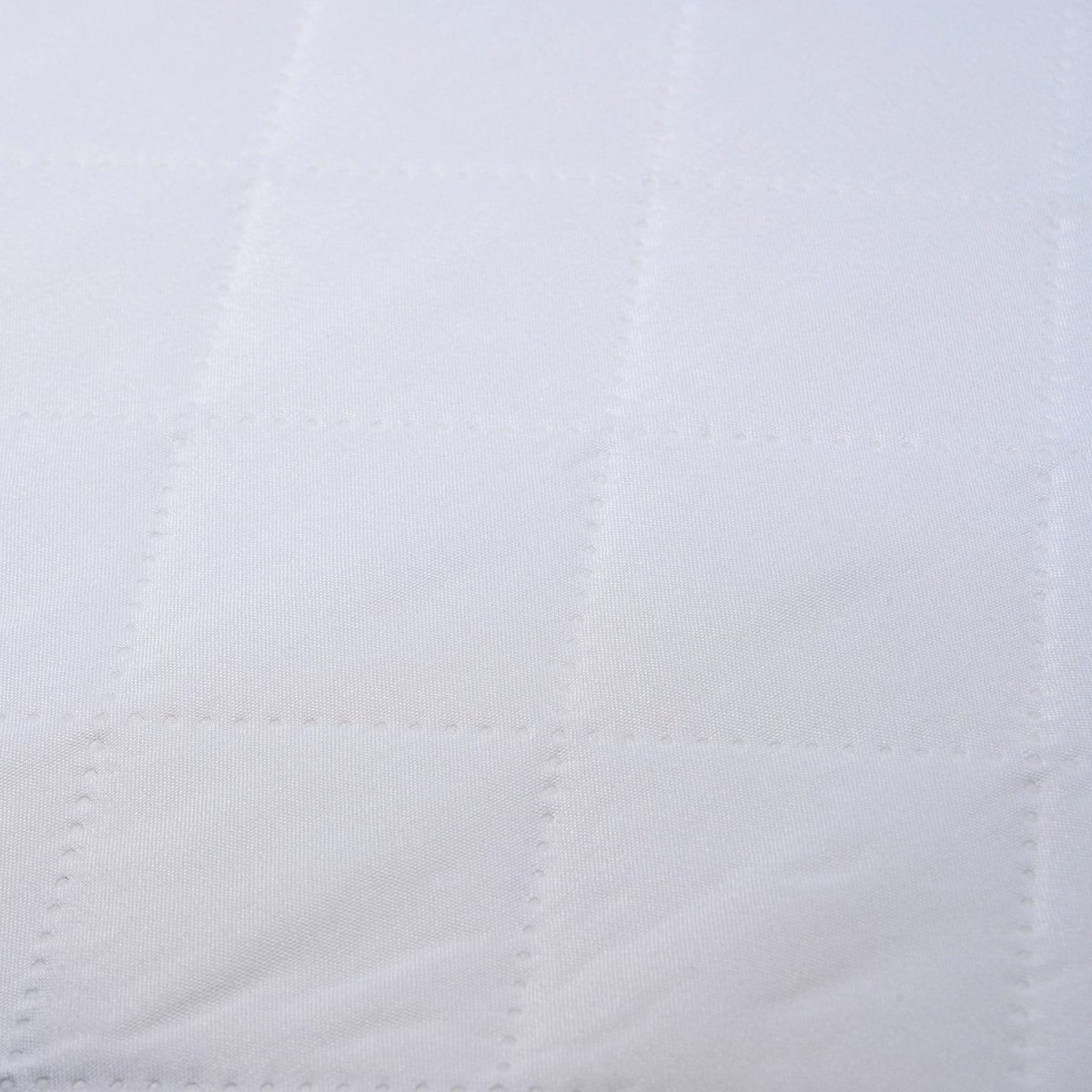 Close-up of a textured white fabric surface