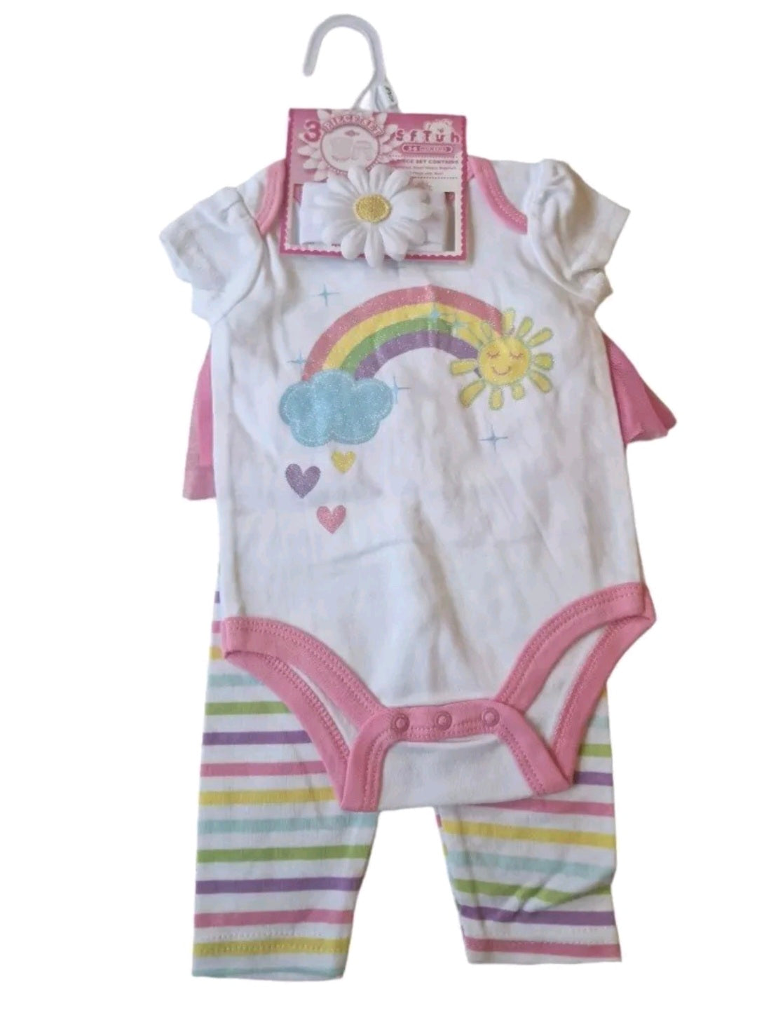 Baby outfit with rainbow and cloud design on a white background
