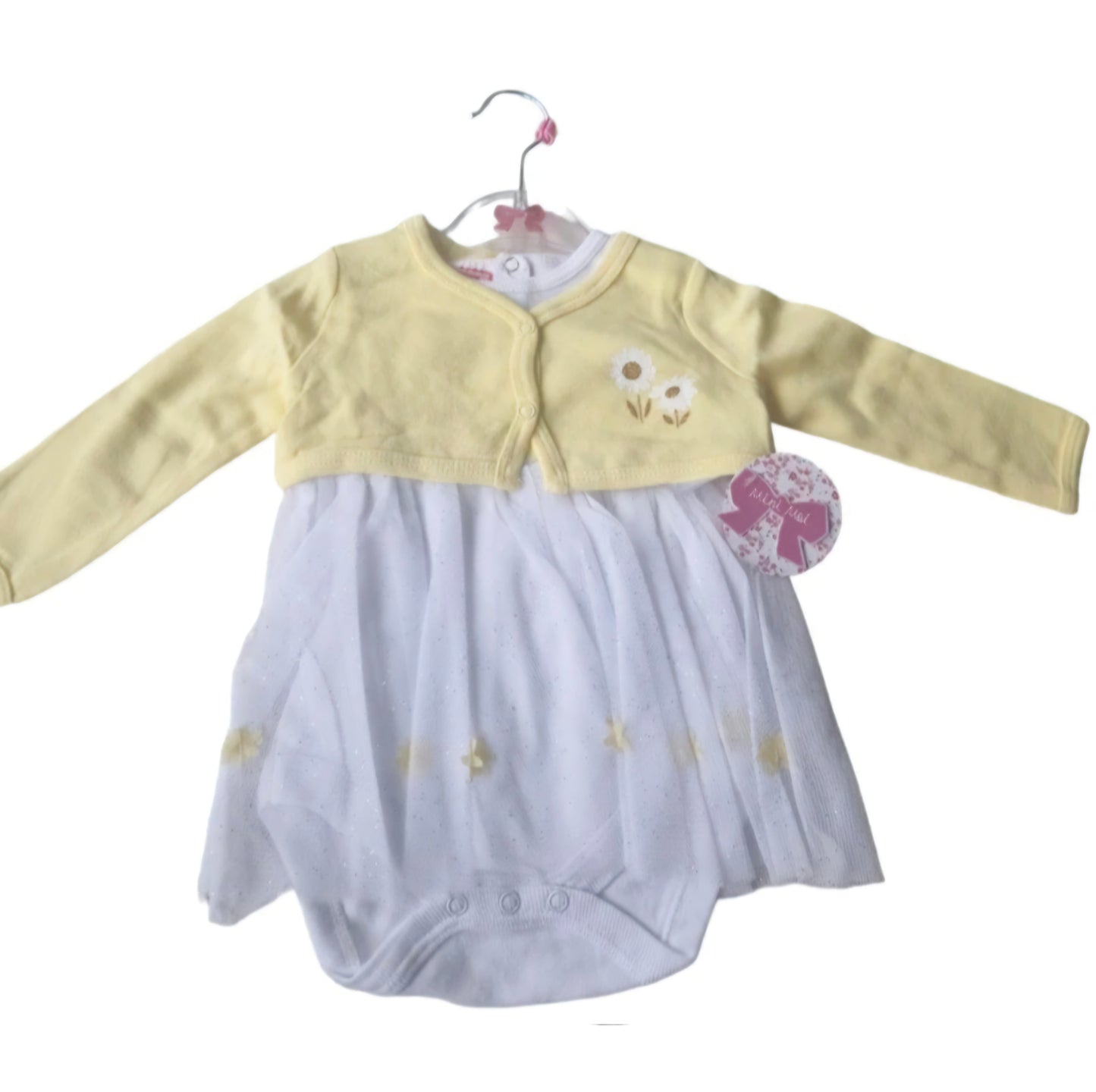 Baby outfit with yellow cardigan and white bodysuit on a hanger against a white background