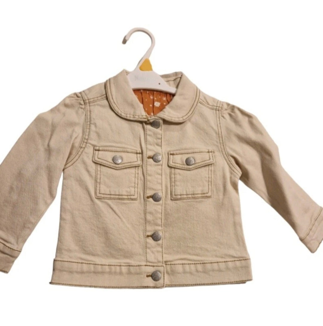 Beige jacket on a hanger against a white background