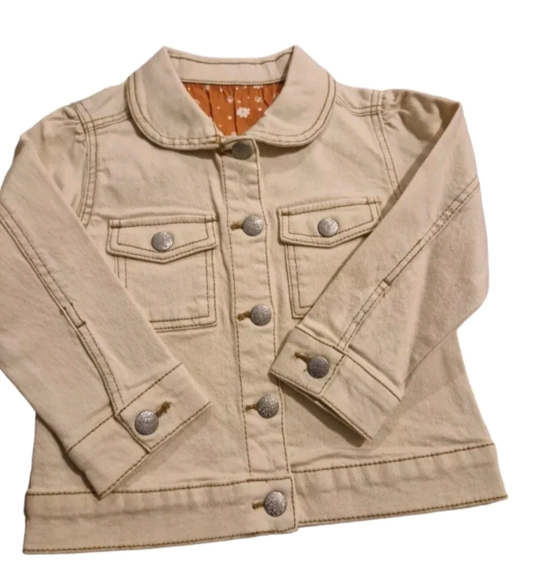 Beige denim jacket with button details on a white background