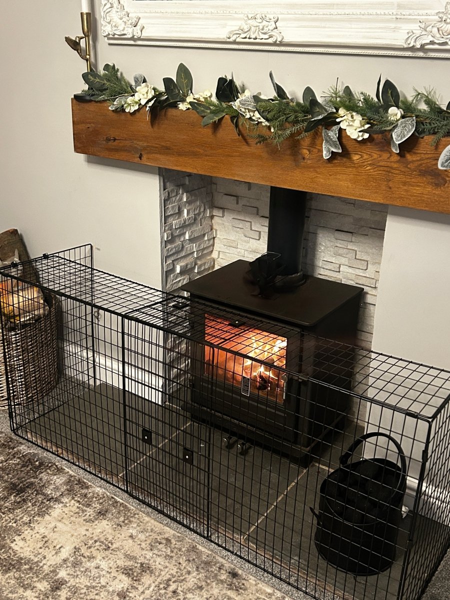 Wood-burning stove with decorative mantel and garland