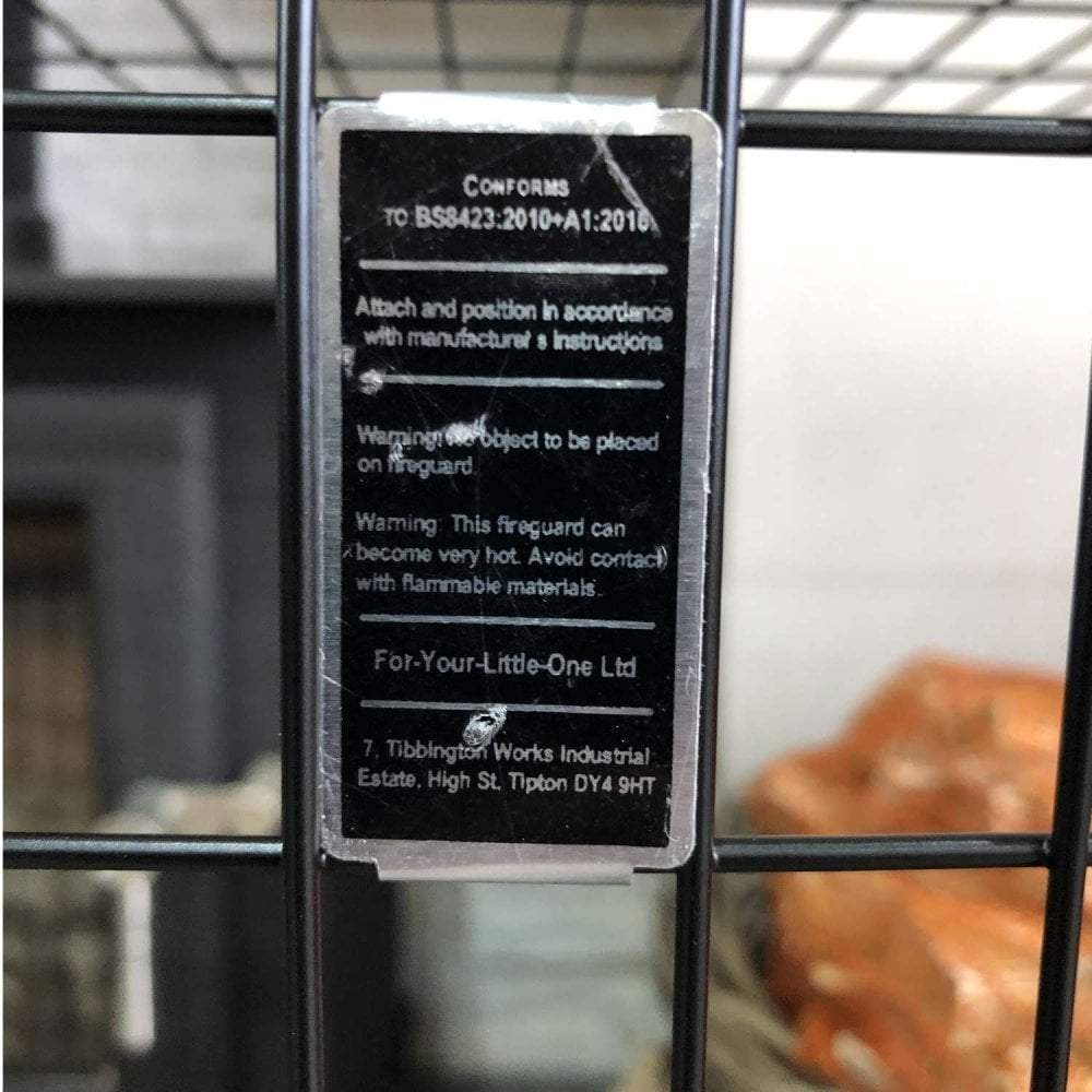 Black label on a metal cage with text and branding