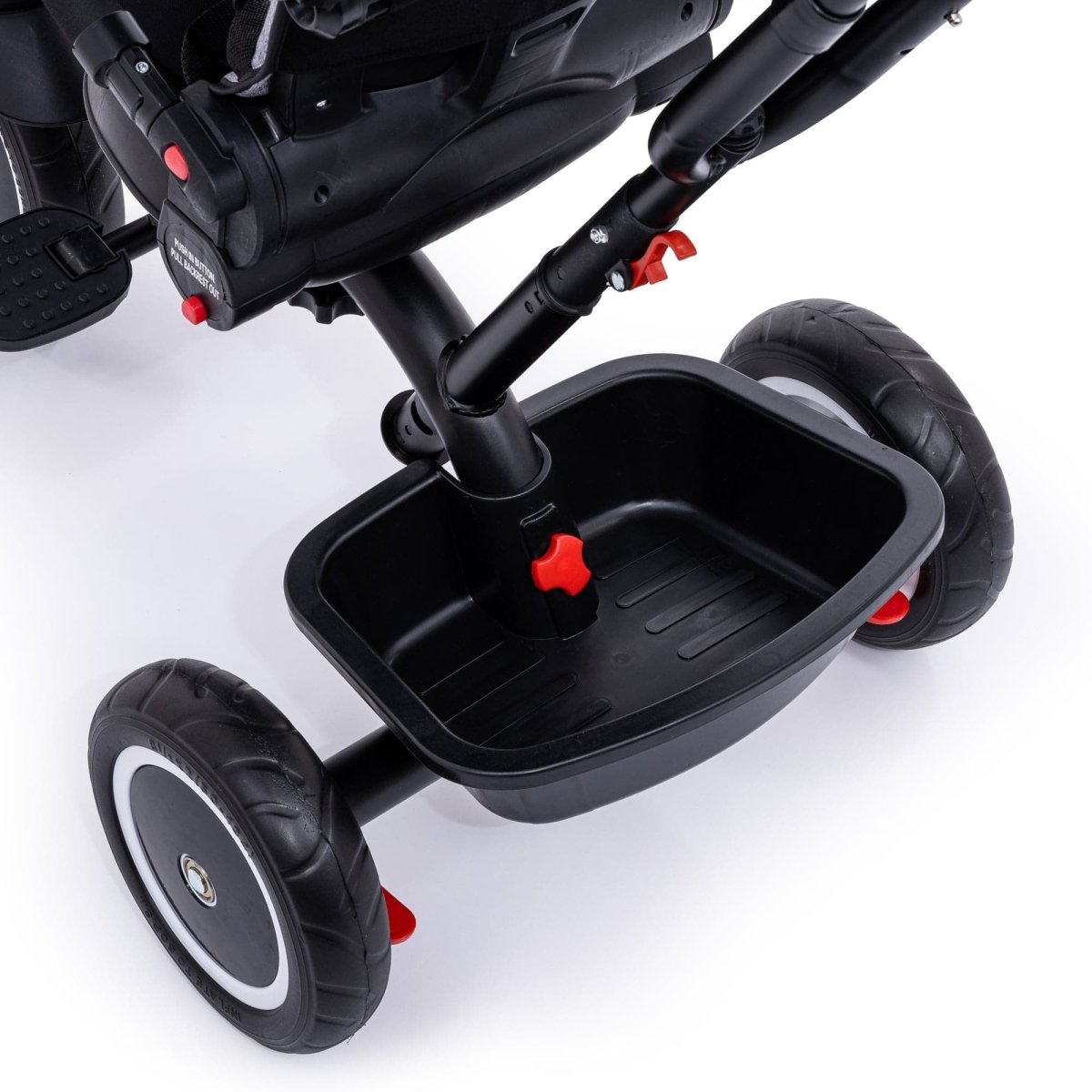 Black stroller with a tray attached on a white background