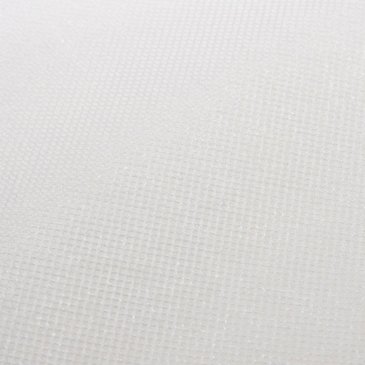 Close-up of a textured white fabric surface