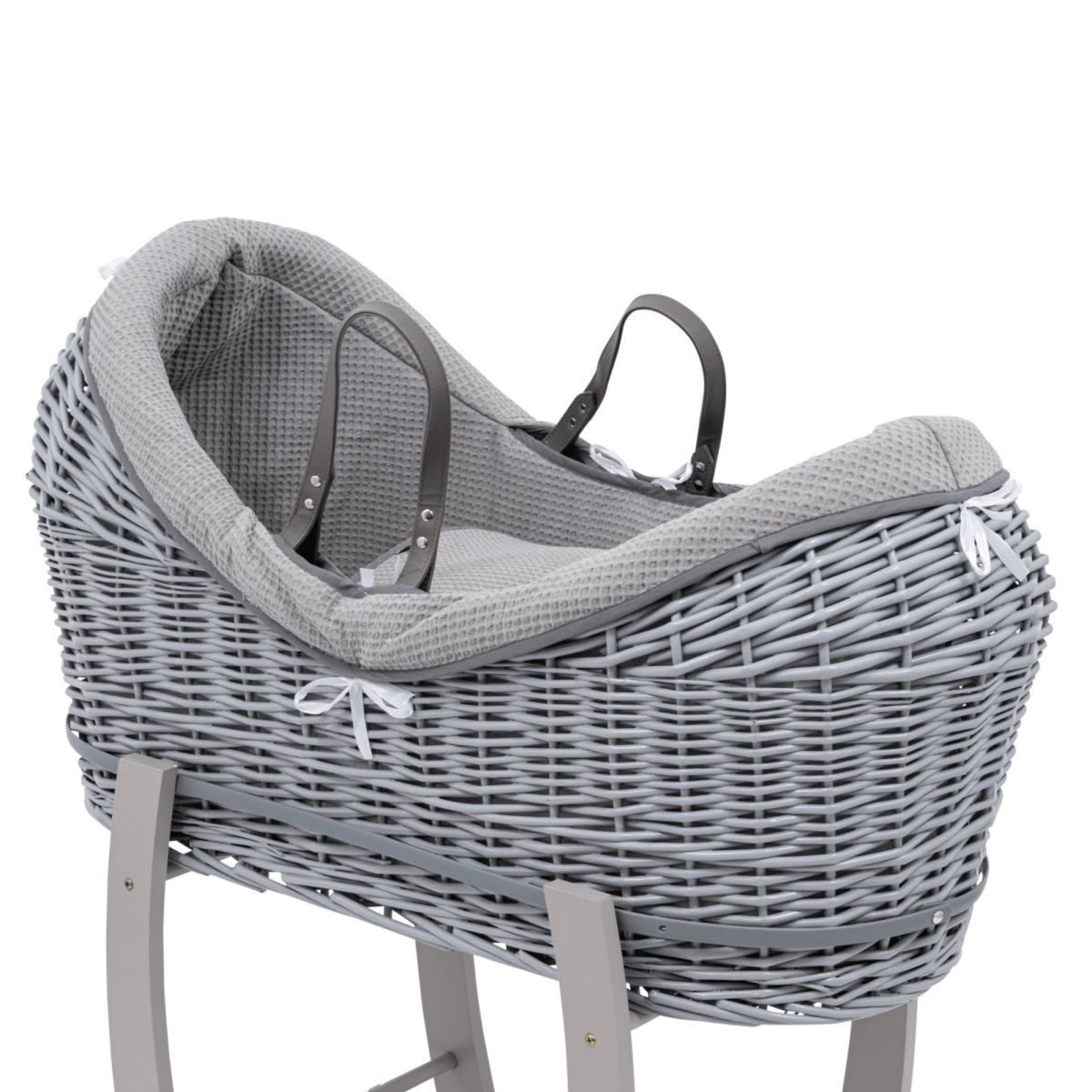 Gray wicker baby Moses basket with a textured cover on a white background