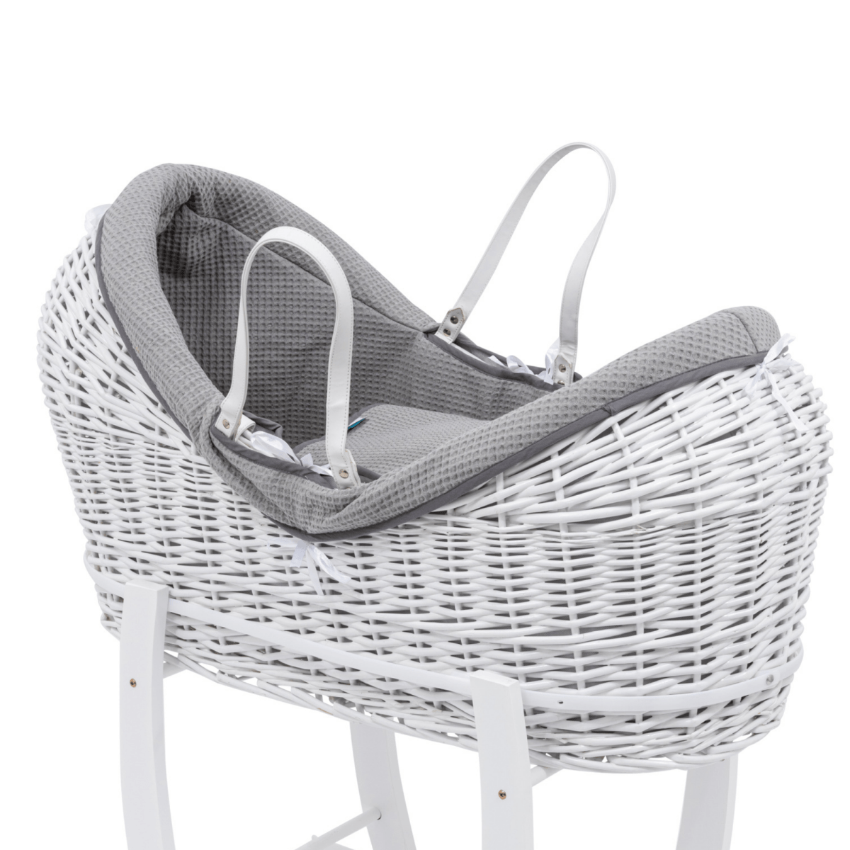 White wicker baby Moses basket with gray lining on a white background
